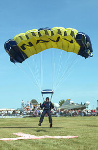 A U.S. Navy display jumper landing a 'square' ram-air parachute