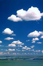 Good gliding weather: Well-formed cumulus humilis, with darker bases, suggests active thermals and light winds.