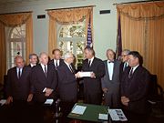 The Warren Commission presents its report to President Johnson