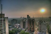 Smog fills the skies of Delhi, India. Measures like CNG-run buses and Delhi Metro have decreased the pollution-level of the city