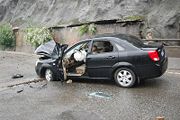 Falling debris, such as the object that landed on this vehicle, hinders rescue workers' progress as they attempt to cross the mountain.