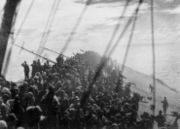 The crew of Zuikaku salute as the flag is lowered, and the Zuikaku ceases to be the flagship of the Imperial Japanese Navy.