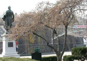 Statue of Hamilton by Franklin Simmons, overlooking the Great Falls of the Passaic River in Paterson, New Jersey. Hamilton envisioned the use of the falls to power new factories.