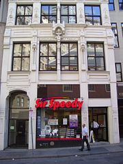 Franklin's Birthplace site directly across from Old South Meeting House on Milk Street is commemorated by a bust above the second floor facade of this building