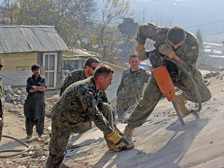 Polish military engineers at work. The Canadian Red Cross donated supplies like toothpaste, tooth brushes, pillows, blankets etc. 140 Polish soldiers were a part of the 1000 troops sent by NATO from ISAF in Afganistan.