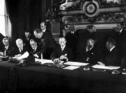 The National Bloc signing the Franco-Syrian Treaty of Independence in Paris in 1936. From left to right: Saadallah al-Jabiri, Jamil Mardam Bey, Hashim al-Atassi (signing), and French Prime Minister L�on Blum.