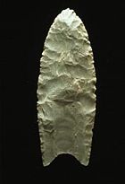 A Clovis point, made via pressure flaking