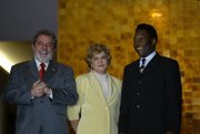 Pel�, right, with Brazil President Luiz In�cio Lula da Silva, left, and First Lady Marisa, July 13, 2004.