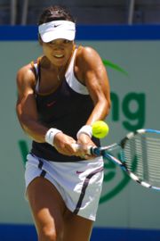 Li Na hitting a two-handed backhand.