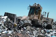 A landfill compaction vehicle in action.