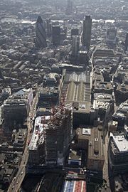 Aerial view with 30 St Mary Axe and Tower 42 in the background. Also seen are the Willis Building, Aviva Tower, 99 Bishopsgate, Liverpool Street Station and the Stock Exchange Tower. At the bottom is the Broadgate Tower, the latest skyscraper to be built in the City.