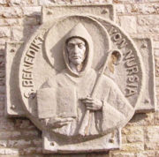 Carving of St. Benedict of Nursia, holding an abbot's crozier and his Rule for Monasteries (M�nsterschwarzach, Germany).