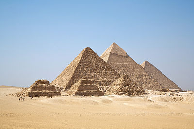 A view of the pyramids at Giza from the plateau to the south of the complex. From right to left are the Great Pyramid of Khufu, the Pyramid of Khafre and the Pyramid of Menkaure. The three smaller pyramids in the foreground are subsidiary structures  associated with Menkaure's pyramid.