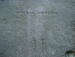 Grafitti on the sarsen stones.  Below are ancient carvings of a dagger and an axe