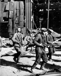 Soviet factory workers heading to the front lines.