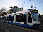 A tram crossing a bridge over the river Amstel