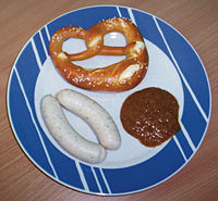 Wei�w�rste with sweet mustard and a Breze (pretzel).