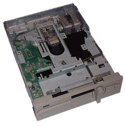 A user inserts the floppy disk, medium opening first, into a 5�-inch floppy disk drive (pictured, an internal model) and moves the lever down (by twisting on this model) to close the drive and engage the motor and heads with the disk.