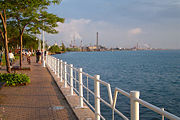 Sarnia, ON, the largest city on Lake Huron, and the St. Clair River shoreline. The smokestacks of Chemical Valley along the river are visible in the background.