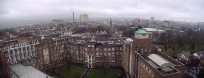 View of Belfast from The Ashby Building, part of QUB. The David Keir Building of Queen's University is in the foreground. The yellow fa�ade of Belfast City Hospital is visible in the centre background, with the city's current tallest building Windsor House in the right background.