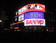 Neon signs of Piccadilly Circus by night.