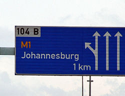 A board on the M1 indicating the exit for Johannesburg. The M1 is one of the busiest highways in Johannesburg.