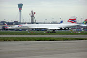 Concorde G-BOAB in storage at London Heathrow Airport following the end of all Concorde flying. This aircraft flew for 22,296 hours between first flight in 1976 and grounding in 2000. The control tower is in the background