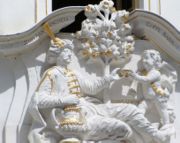 Over the door of a Leipzig coffeeshop is a sculptural representation of a man in Turkish dress receiving a cup of coffee from a boy.