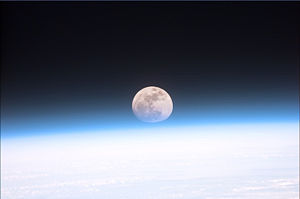 This view from orbit shows the full Moon partially obscured by the Earth's atmosphere. NASA image.