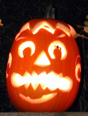 A pumpkin carved into a Jack-o'-lantern for Halloween.