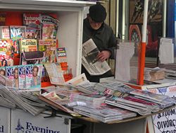 Newspaper vendor, Paddington, London, February 2005