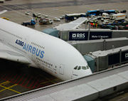 A380 being serviced by three separate jetways at Frankfurt Airport; two for the main deck and one for the upper deck.