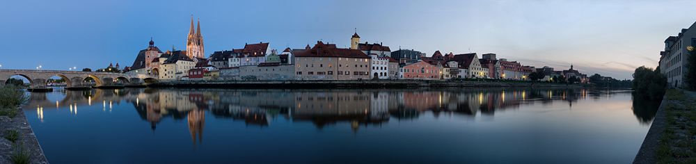 A panoramic view of central Regensburg at twilight