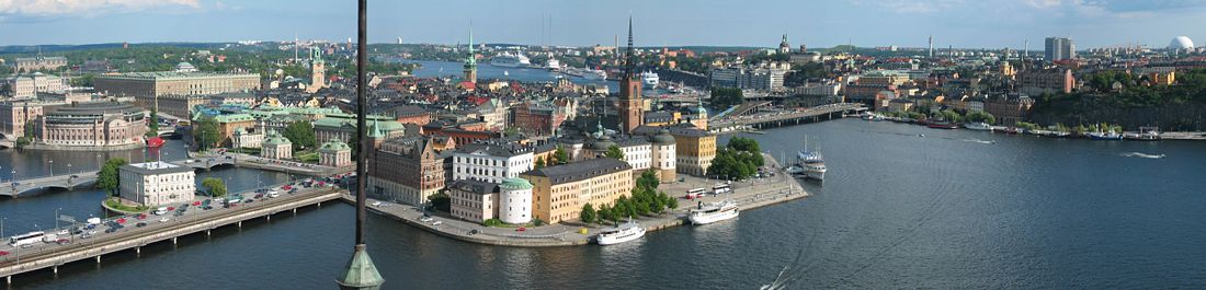 Stockholm panorama as seen from the tower of Stadshuset, looking east over Riddarfjärden towards the Old town, Riddarholmen, and Södermalm. To the left, from front to back, Centralbron, Strömsborg and Vasabron with Riksdagen, National Museum and Nordic Museum further distant; to the right of Riksdagen, the Royal Palace; center, Riddarholmen with Riddarholmskyrkan, further back, Gamla stan with Storkyrkan and Tyska kyrkan, Saltsjön with the ferry terminal on the shore of Södermalm; to the right of Riddarholmen, Slussen and Södermalm, with Globen to the far right.