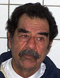 Saddam shortly after capture by American forces, and after being shaved to confirm his identity