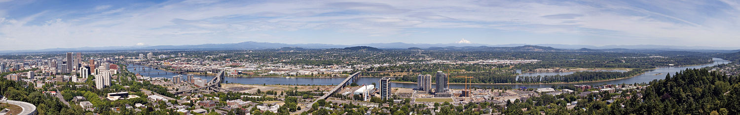 The Willamette River runs through the center of the city, while Mount Tabor (center) rises on the city's east side.  Mount Saint Helens (left) and Mount Hood (right center) are visible from many places in the city.