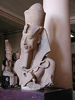 Statue" of Akhenaten in typical Amarna style.