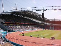 City of Manchester Stadium during the 2002 Commonwealth Games, with two tiers of permanent seating