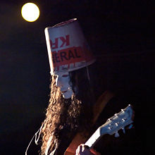 Buckethead performing live, April 2006 wearing the famous bucket stating "KFC FUNERAL"