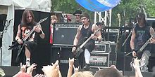 Bullet for My Valentine performing at Earthday Birthday, on April 29, 2007 (from left to right: Michael Paget, Jason James, and Matt Tuck).