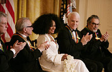 Diana Ross is applauded by her fellow Kennedy Center honorees as she is recognized for her achievements by President George W. Bush in the East Room of the White House Sunday, Dec. 2, 2007, during the Kennedy Center Gala Reception. From left are singer, songwriter Brian Wilson; filmmaker Martin Scorsese; comedian, actor and author Steve Martin and pianist Leon Fleisher.