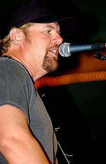 Toby Keith performs for the troops at the O'Callahan's Cantina at Camp LeMonier, Djibouti, on May 31, 2006.