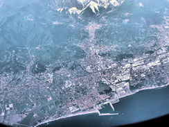 The area around Carrara, seen from an aircraft flying at 10,000 meters. The town is at the top of the picture, nearest to the marble quarries which are the white markings on the mountains.