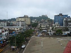 Broad Street, Monrovia, Liberia. The Old Ducor Hotel is visible in the background.