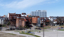 Historic buildings line St. Paul Street in Downtown St. Catharines; the former bed of the First Welland canal is in the foreground.