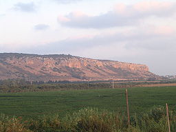 none Mount Carmel at sunset, as seen from the entrance of Kibbutz Ma'agan Michael