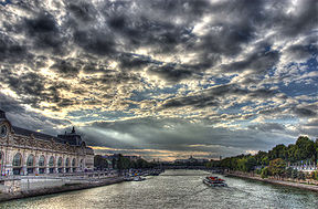 The Seine as seen from the Pont Royal. The Musée d'Orsay is visible in the left foreground and the Grand Palais is in the right background.