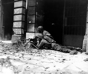 GI machine gun crew in Aachen.jpg