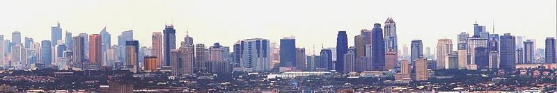 Skyline of Ortigas Center in the foreground with Makati in the background on the left