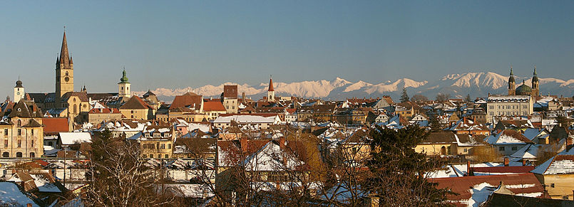 Sibiu Skyline from left to right: Council Tower, Evangelical Lutheran Cathedral, Catholic Church, Reformed (Calvinist) Church, Orthodox Cathedral and in the background the highest peak Negoiu.